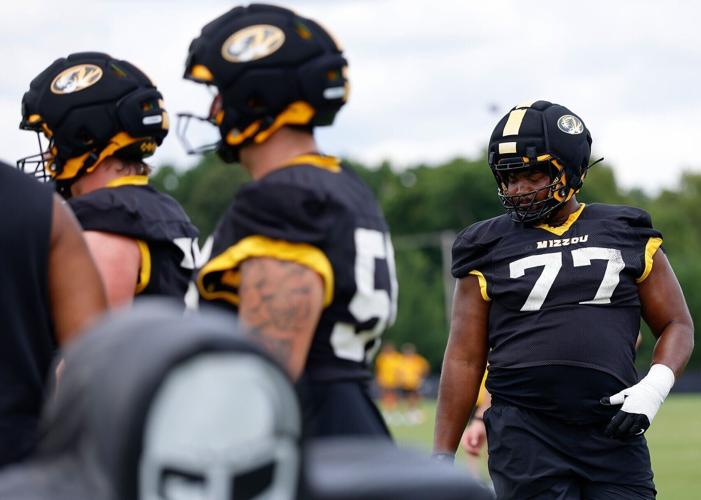 Offensive lineman Curtis Peagler (77) participates in a practice