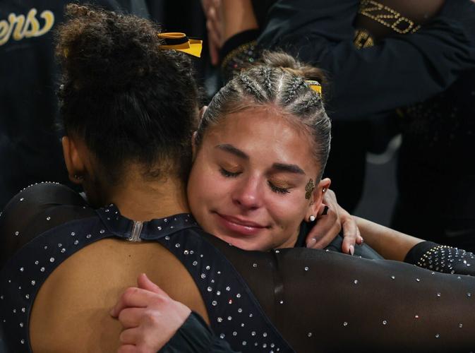 Amy Wier embraces her teammate after the news