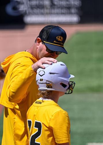 Mizzou infielder Sophie Smith (22) talks with Hitting Coordinator, Jake Epstein,