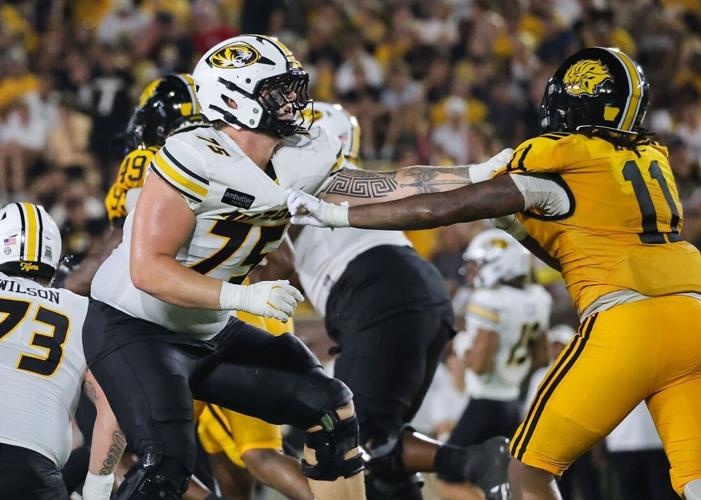 Mizzou offensive lineman Jack Lange (75) blocks a Pine-Bluff defender