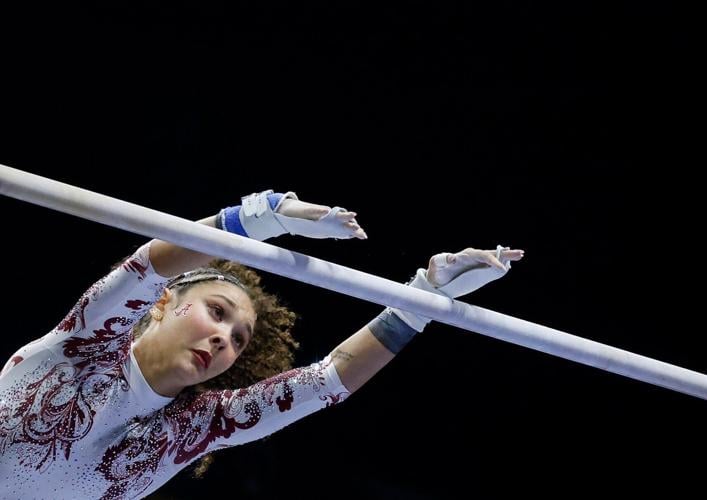 Alabama’s Paityn Walker performs her uneven bars routine