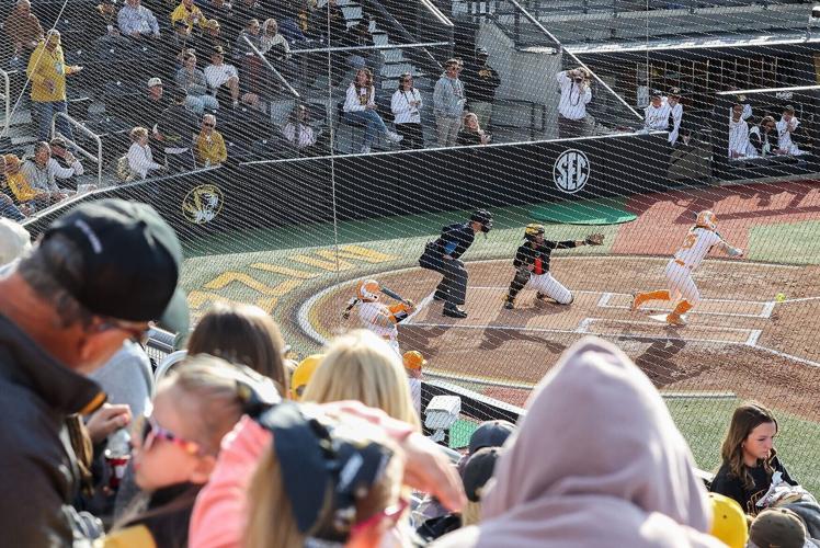 Fans watch as Tennessee infielder Ella Dodge hits the ball