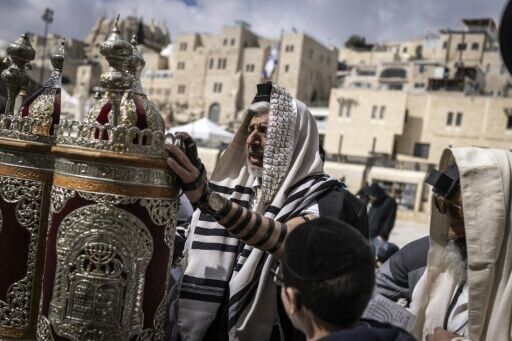 At the Western Wall, dozens of Jewish worshippers prayed in the late morning