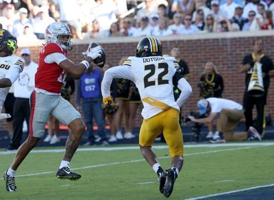 Ole Miss wide receiver Horatio Fields (11) attempts to run past Mizzou safety Elijah Dotson (22)