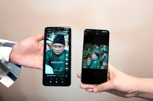 This photo illustration shows phones displaying the screenshots of Chinese Hanfu stylist Baicai's social media post (left) and the AI microdrama (right) accused of stealing his likeness