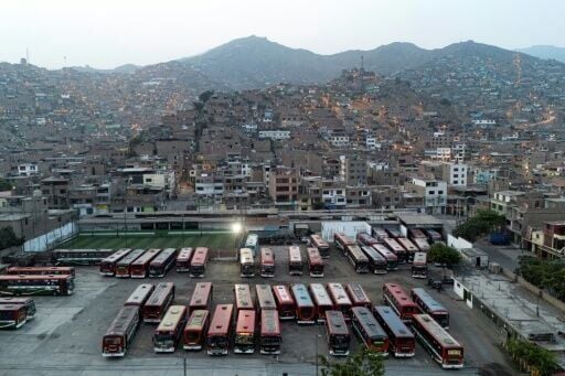 Buses at the Santa Catalina terminal ahead of Sunday's election, in which candidates have made promises to fight crime and extortion.