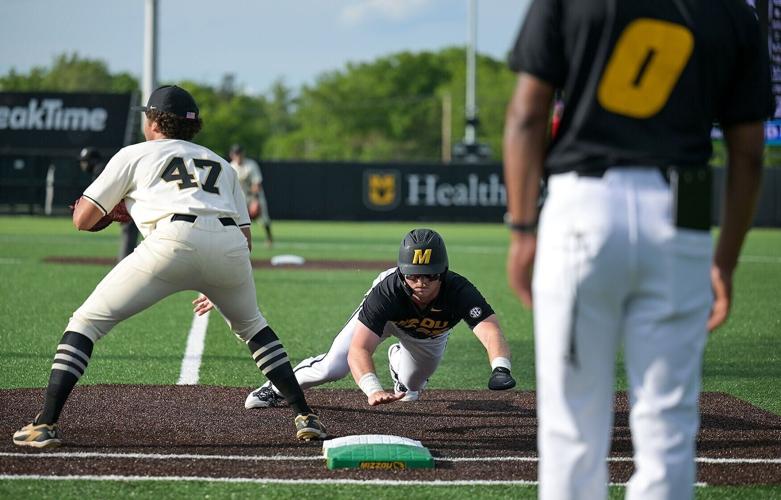 Mizzou first baseman Jase Woita dives back to first base