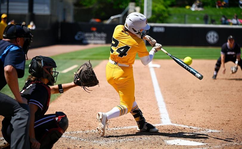 Mizzou sophomore Madison Uptegrove (24) hits the ball