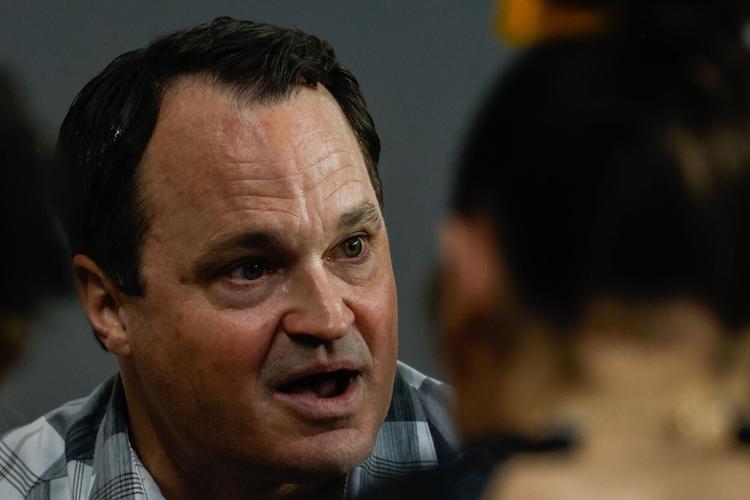 Coach Shannon Welker speaks to the team