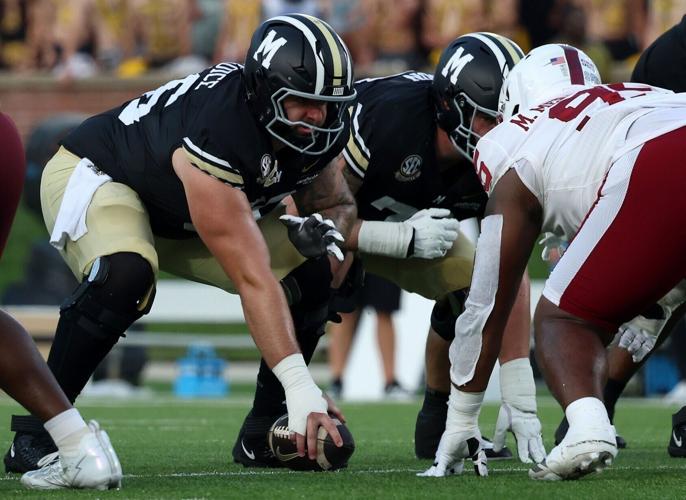 Mizzou center Dominick Giudice (56) prepares to hike the ball