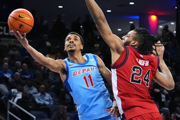 DePaul guard CJ Gunn, left, drives to (copy)