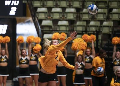 Outside hitter Paige Felder serves the ball