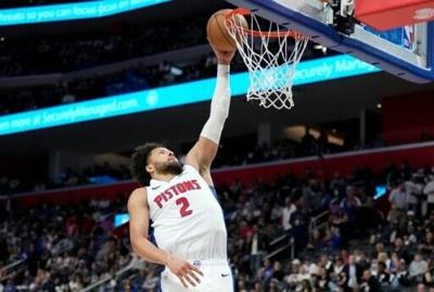 Detroit's Cade Cunningham throws down a dunk in the Pistons' series-clinching NBA playoff win over the Orlando Magic