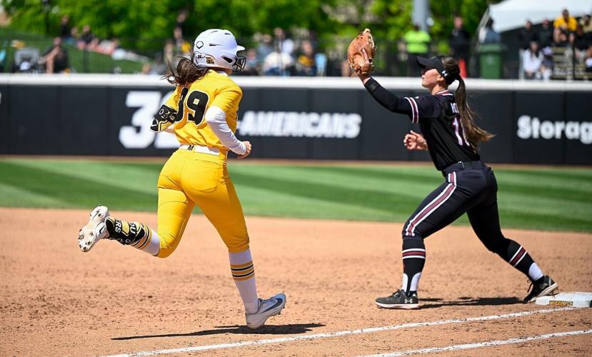 Mizzou utility player Kayley Lenger (99) runs to first base