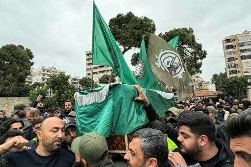 Mourners carry the coffin of a militant from the Hezbollah-allied Amal movement killed in southern Lebanon during his funeral in the Shayyah neighbourhood of Beirut’s southern suburbs on April 2, 2026. Lebanon was drawn into the Middle East war on March...
