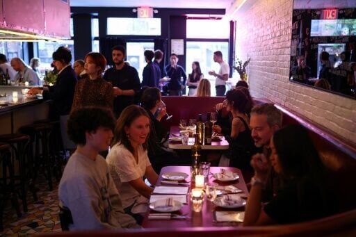 Customers eat during dinner in the French restaurant Gigi’s in the Brooklyn borough of New York on April 26, 2026.