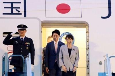 Japan's Prime Minister Sanae Takaichi (R) disembarks a plane upon arrival at Noi Bai International Airport in Hanoi on May 1, 2026.