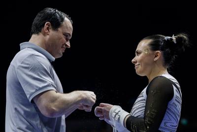 Mizzou gymnastics head coach Shannon Welker fist bumps Lauren Macpherson (copy)