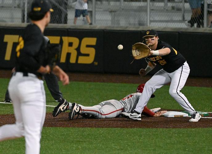 Arkansas baserunner Ryder Helfrick reaches first safely before Mizzou infielder Jase Woita could catch the ball (copy)