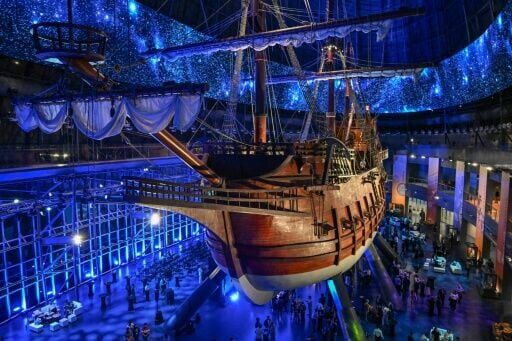 Visitors under the Galeon Espiritu Santo, a full-scale representation of a 17th century galleon, on display at the Museo del Galeon in Manila