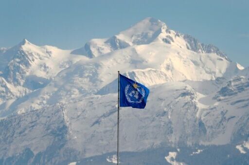 The WMO flag seen above its headquarters in Geneva, in front of the Mont Blanc massif