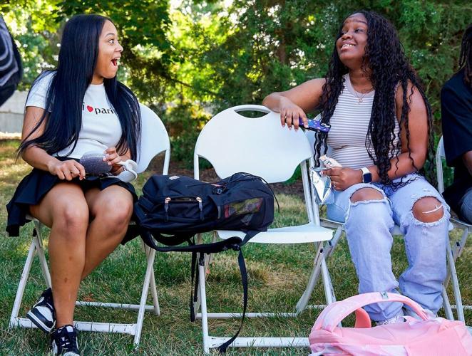 MU freshman Haley Baker, left, chats