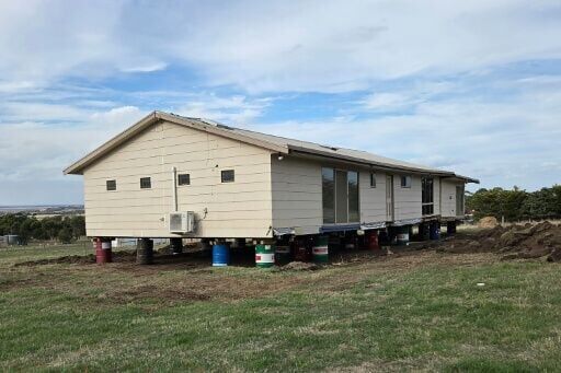 Melanie and David Moor had to move their house after discovering it was placed on the wrong plot