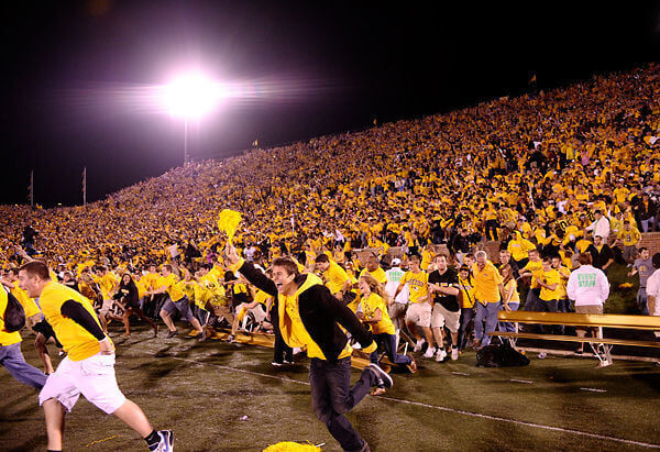 Fans rush the field after the Missouri win against OU (copy)