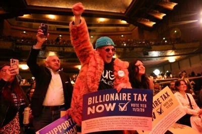 People chant in support of a tax on billionaires during a Bernie Sanders rally in Los Angeles in February