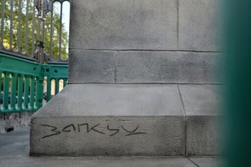 The statue bears the name of legendary street artist Banksy