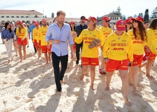 Britain's Prince Harry and his wife meet with volunteer first responders at Bondi Beach in Sydney.