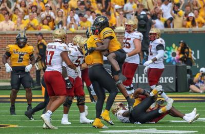 Mizzou cornerback Toriano Pride Jr. celebrates with Mizzou defensive end Zion Young (copy) (copy) (copy)