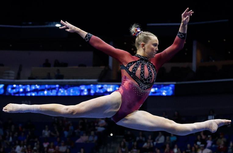 Oklahoma’s Ella Murphy leaps during her floor routine