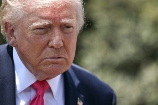 US President Donald Trump speaks to reporters before walking to board Marine One as he departs from the South Lawn of the White House in Washington