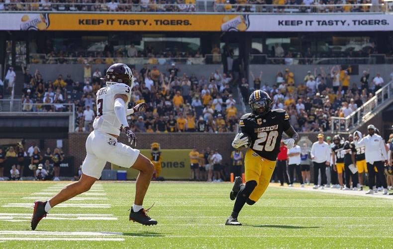 Mizzou running back Jamal Roberts (20) runs the ball as Missouri goes against Texas A&M