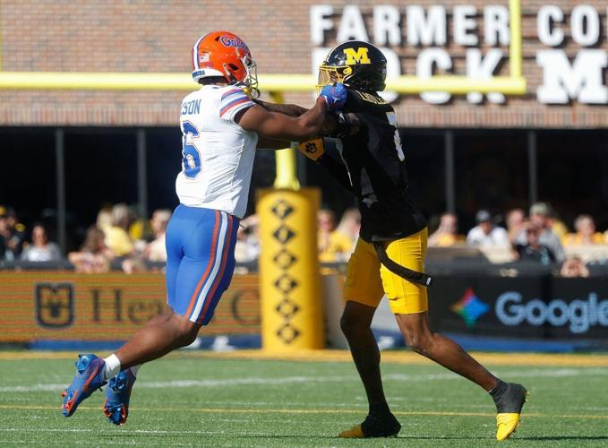 Florida receiver Dallas Wilson (6) engages with Mizzou cornerback Sione Laulea (copy)