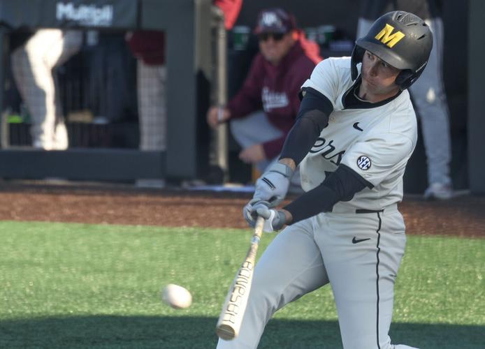 Mizzou infielder Blaize Ward (19) swings for the ball