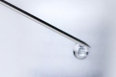 A syringe with a vial filled with Covid-19 vaccine. Negotiators have a week to complete the missing piece of the agreement