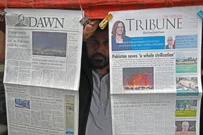 A vendor displays morning newspapers at his roadside stall in Islamabad. Pakistan has emerged as a key intermediary between Iran and the United States to secure a temporary ceasefire and host negotiations to end the war in the Middle East
