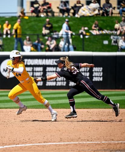 Freshman Linny Ramsey (44) attempts to escape a tag out