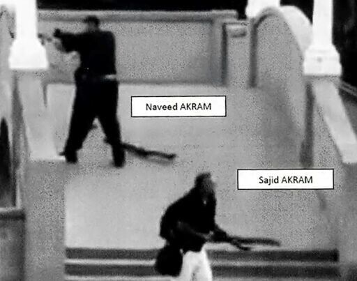 This handout photo from a court exhibit shows Sajid and Naveed Akram, armed with three firearms, allegedly shooting towards the crowd gathered at Bondi Beach.