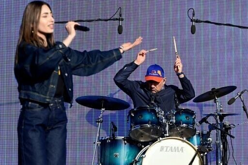 Armenian Prime Minister Nikol Pashinyan plays the drums as he performs with his Varchaband band on Sunday