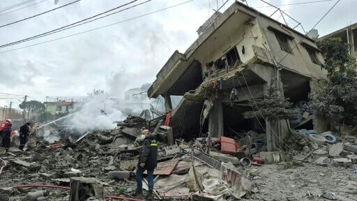 First aid responders at the site of an Israeli air strike that targeted a southern Lebanese village