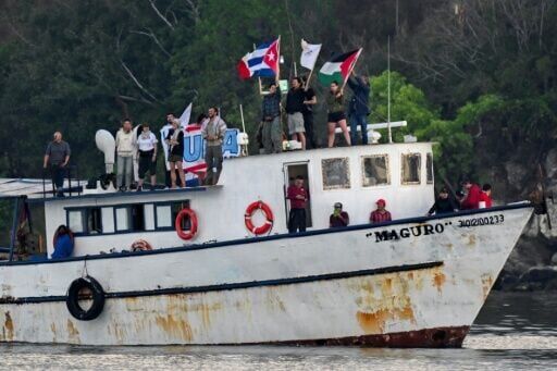 Activists chanted 'Cuba yes! Blockade no!' as the aid boat arrived in Havana