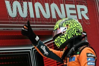 McLaren's British driver Lando Norris celebrates after winning the 2026 Miami Formula One Sprint race