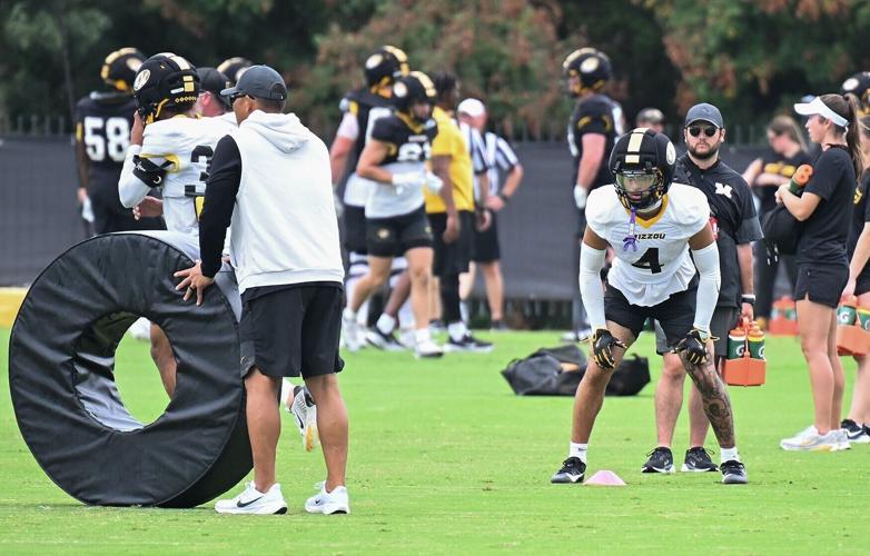 Mizzou safety Trajen Greco (4) lines up for a tackle drill