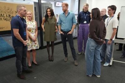 Britain's Prince Harry and his wife Meghan meet staff members and young advocates during a visit to a Melbourne mental health engagement programme as part of their four-day tour of Australia