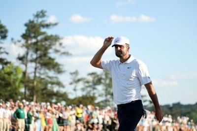 Scottie Scheffler walks off the 18th green after his bid to complete a record Masters comeback falls short