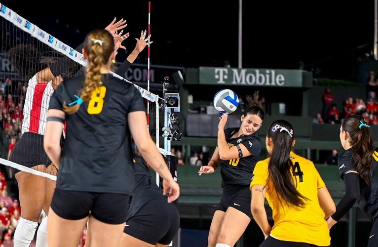 Ride-side hitter, Maca Lobaglio (10), braces as the volleyball comes back after hitting the net (copy)