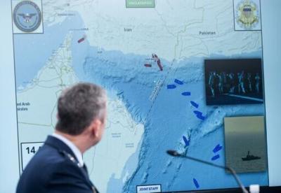 US Chairman of the Joint Chiefs of Staff General Dan Caine shows a map of the Strait of Hormuz at a Pentagon press briefing